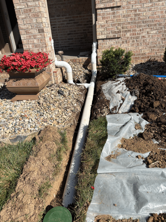 During photo – Edna Knight Downspout Extensions New Palestine